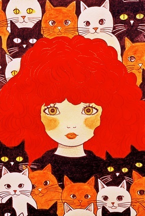 a woman with red hair surrounded by cats